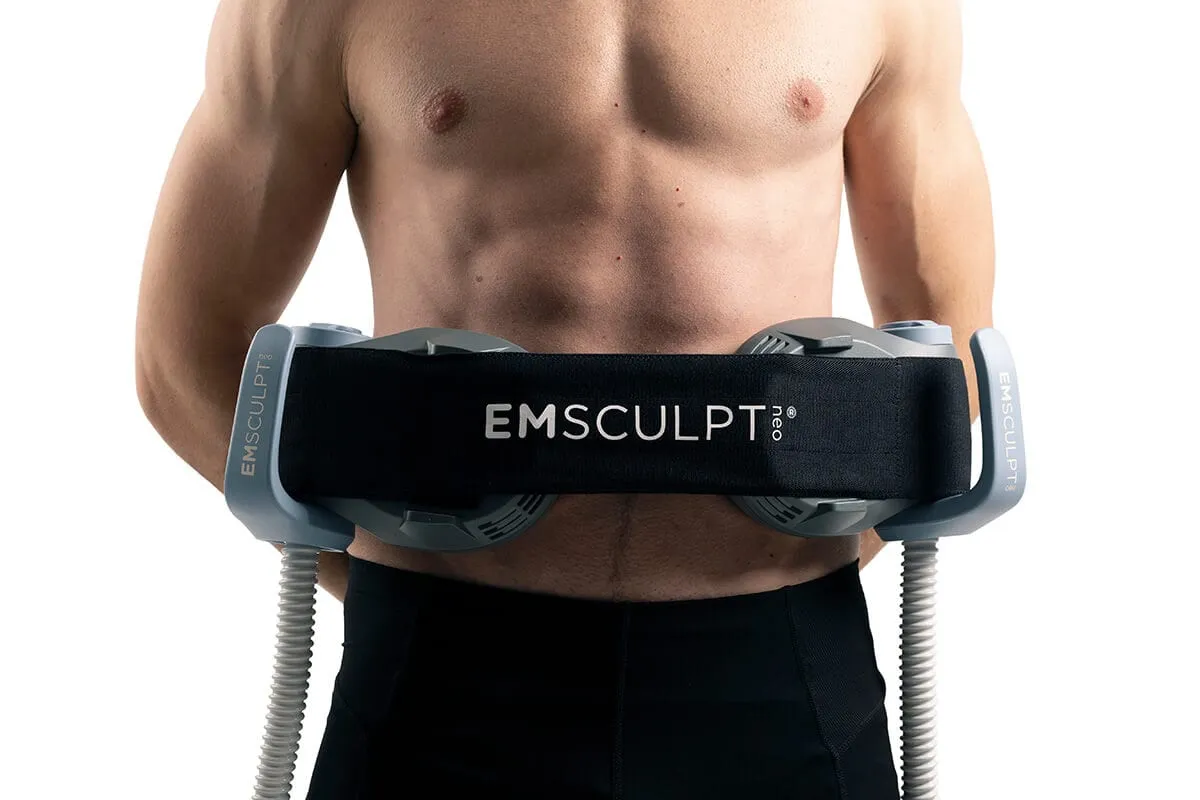 The EMSCULPT NEO belt fastened around a man's midsection, the applicators sitting flat against the abdominal muscles.